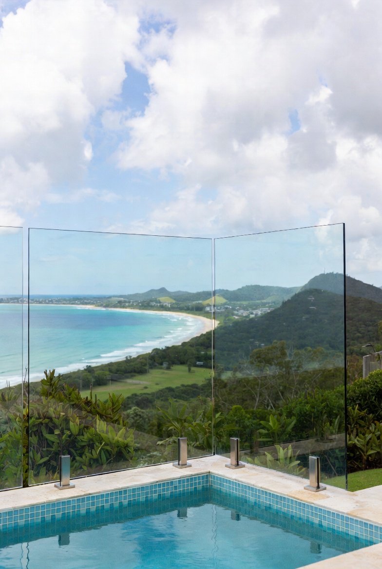 Infinity pool edge with frameless glass balustrade